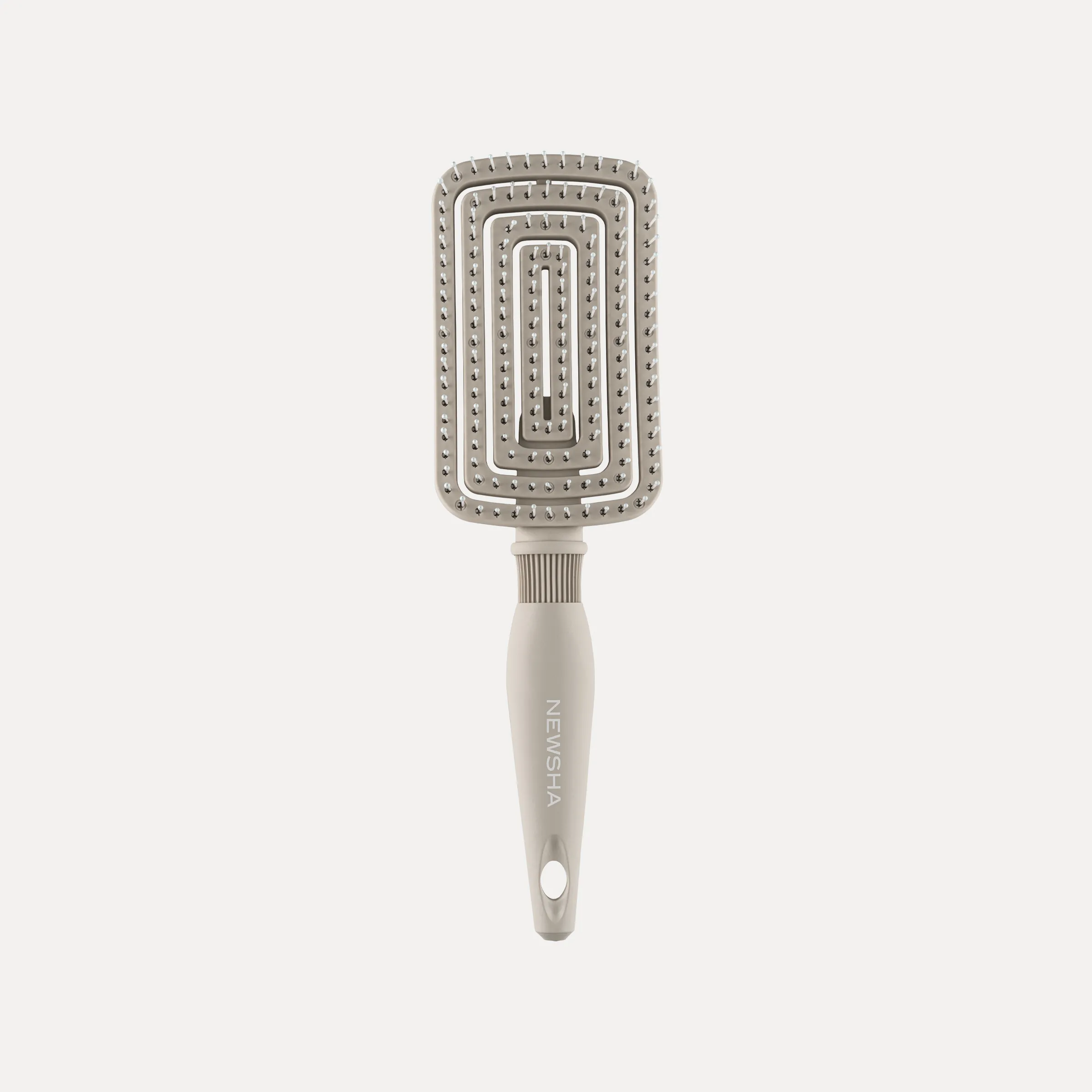 Beige NEWSHA Flexible Vent Brush mit rechteckigem Bürstenkopf und flexiblen Borsten vor hellem Hintergrund.