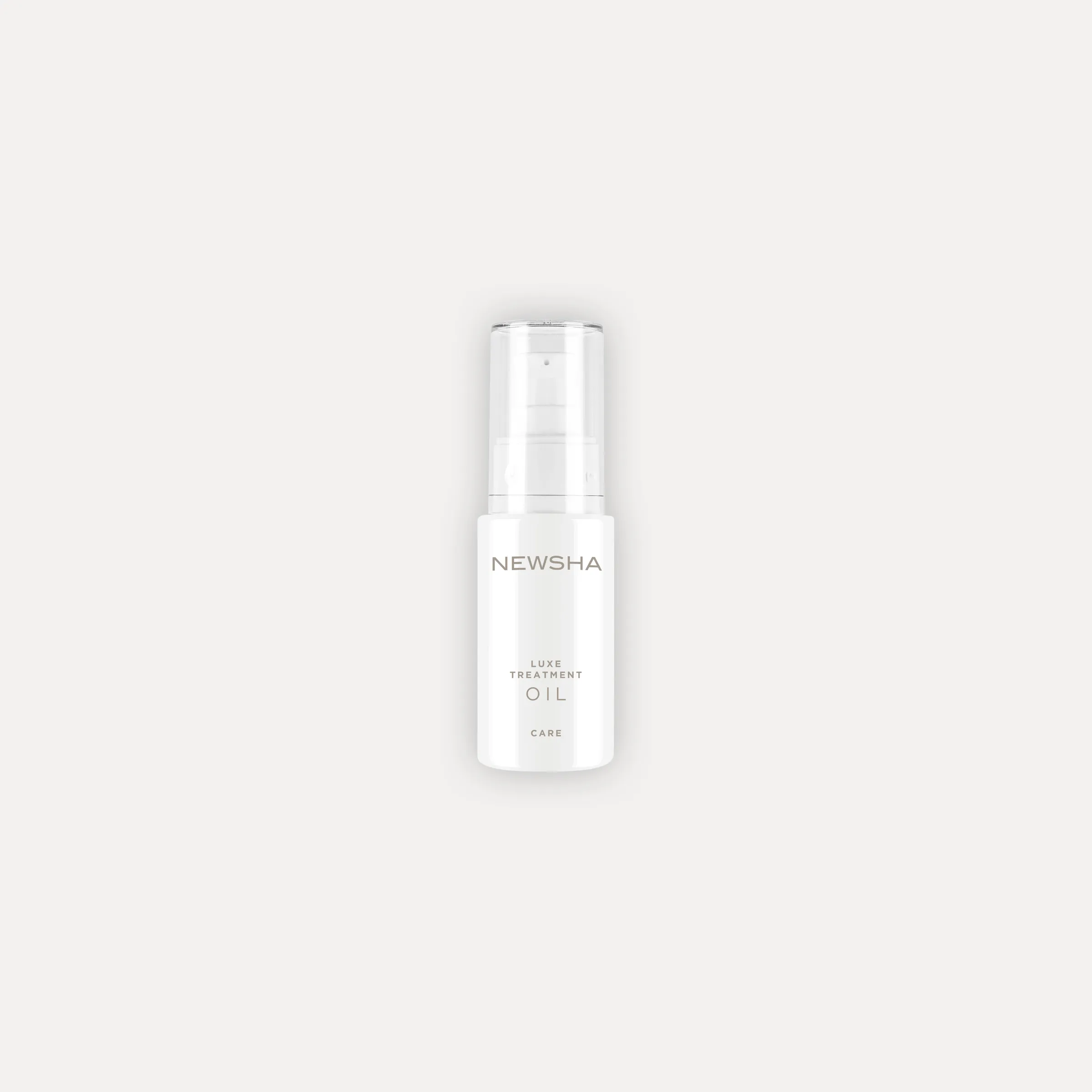 NEWSHA Luxe Treatment Oil als minimalistisches Produktbild vor hellem Hintergrund.